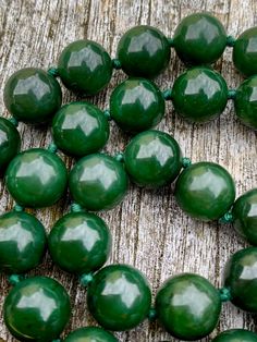 Deep Green Uniform 7mm Spheres of Jade each bead hand knotted,closed with a decorative pierced Clasp .Stunning highly polished beads 71g weight, in original box, 1970s. Classic Beaded Necklace With Large Beads, Jade Beaded Necklace With Polished Beads, Classic Green Beaded Necklaces With Round Beads, Classic Round Large Beads, Single Strand Jade Beaded Necklace With Round Beads, Large Jade Beads For Jewelry Making, Classic Large Round Beads, Jade Beaded Necklaces With Round Beads, Jade Beads With Large Beads For Gifts