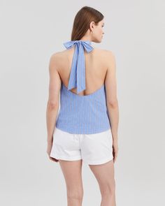 The Barbara Halter Top, made in our cotton poplin fabric, features a high neckline with an open back and ties at the neck. Pair with the Loretto Short. Spring Beach Tops With Bow Tie Back, Summer Cotton Tie Back Blouse, Summer Cotton Blouse With Tie Back, Chic Cotton Blouse With Tie Back, Chic Cotton Tie Neck Top, Summer Cotton Tie Neck Top, Chic Cotton Halter Top For Day Out, Cotton Tie-back Backless Top, Cotton Tie Back Backless Top