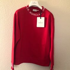 Grand New Moncler Red Round Neck Jumper Logo Sweatshirt. Size: Small Crew Neckline Long Sleeves With Logo Hem Hits Below The Hip. Pullover Style. Regular Fit Cotton Base. Wash Max 30c Shoulders: 19” Sleeve: 23” Breast: 20” Waterfall: 18” Length:65 “ Price Is Firm. Designer Red Long Sleeve Tops, Designer Long Sleeve Red Top, Designer Red Tops For Fall, Designer Red Crew Neck Top, Moncler Sweater, Logo Sweatshirt, Pullover Styling, Crew Neckline, Jumper