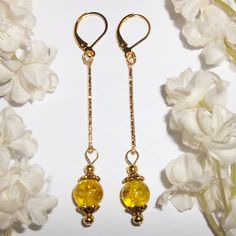 You Will Love The Long Length Of This Golden Beaded Earring Set. Brand New And Handmade By Me. Done With Yellow Crackled Glass Beads. It Also Has Shiny Gold Toned Costume Jewelry Beads That Were Antiqued In Black. The Long Gold Stick Bar Has Diamond Cuts On It That Sparkle In The Light. The Pair Dangle & Drop From Lever Backs For Women's Pierced Ears. 2 5/8 Inches Tall & 3/8 Inch Wide. Each Single Earring Weighs 1.7 Grams. Very Lightweight, Delicate, & Dainty. Glamorous & Sophisticated Fashion! Yellow Earrings For Party, Elegant Handmade Yellow Earrings, Yellow Jewelry With Ear Wire For Party, Party Jewelry With Yellow Ear Wire, Yellow Ear Wire Party Earrings, Yellow Dangle Jewelry With Matching Earrings, Yellow Dangle Earrings With Ear Wire, Handmade Yellow Earrings For Party, Adjustable Yellow Dangle Jewelry