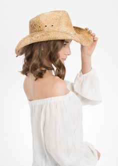 The Peter Grimm Eliza Women's Hat is a beach drifter cowgirl hat made from 100% Moroccan straw. This is a stunning and unique western style drifter hat in an eye-catching light brown. Features a whimsical hippie style row of daisy flowers on the band making it perfect for the hippie chick at her free spirited summertime concerts. You'll be the most noticeable cowgirl in town. Perfect for the rodeo, a trip to Nashville or a country music concert. A shipping charge of $12.00 covers the special pac Natural Straw Hat With Curved Brim For Western-themed Events, Natural Color Hat Bands For Rodeo In Spring, Natural Straw Hat With Curved Brim For Western Events, Rustic Wide Brim Straw Hat For Kentucky Derby, Rustic Hat Bands With Curved Brim, Rustic Curved Brim Hat Bands, Natural Wide Brim Straw Hat For Western-themed Events, Rustic Wide Brim Straw Hat For Rodeo, Rustic Fitted Hats For The Beach