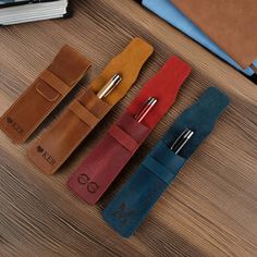 This customized leather pencil case is made from high-quality leather material and finely processed to ensure softness and durability. We offer a variety of colors, and you can also personalize it with your name to create a unique and exclusive pencil case, making it an excellent gift for friends or yourself. Color: Brown, Green, Blue, Dark Brown, Red, Purple, Black Overall size:  L--16.5 x 7 inches(6.4 x 2.7 cm) S--16.5 x 5 inches(6.4 x 1.9 cm) Owning such a customized leather pencil case not o Engraved Pencils, Leather Pen Case, Custom Pen, Leather Pencil Case, Personalised Pens, Custom Pens, Pen Pouch, Pencil Bag, Pencil Bags