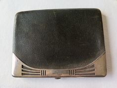 A very nice leather wallet with solid silver trim.  Brown leather with elegant solid silver applications, there is the monogram PM or MP. Inside it is lined with black silky fabric, which is a bit frayed, so it is delicate and needs attention and care in case you want to use it.  The wallet is slim but with a lot of space for banknotes and card, as you can see from the pictures.  Measures: ca. 13 x 10 cm - 5.11 x 3.93 inches Weight: 83 grams.  There is an hallmark, not easily readable, shown in Compact Formal Wallet With Coin Pocket, Elegant Compact Wallet For Formal Occasions, Elegant Compact Wallets For Formal Occasions, Formal Compact Card Holder With Coin Pocket, Formal Compact Leather Card Holder, Classic Compact Wallet For Formal Occasions, Classic Compact Wallets For Formal Occasions, Compact Formal Wallets With Card Slots, Classic Compact Formal Wallets