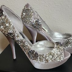 Brand: Nina Style: Sadi Size: 10 Color: Royal Silver Nib - Never Worn! Perfect Condition. Perfect Wedding Or Event Shoes Beautiful Satin Platform Heels. Embellished With Sequins And Beading. Detailed And Eye-Catching! Spring Silver Pointed Toe Wedding Shoes, Silver Round Toe Wedding Shoes For Party, Silver Pointed Toe Wedding Shoes For Spring, Glamorous Metallic Silver Closed Toe Heels, Sequined High Heel Party Wedding Shoes, Sequin High Heel Party Wedding Shoes, High Heel Sequin Wedding Shoes For Party, Sequin High Heel Wedding Shoes, Silver Sequined Heels For Wedding