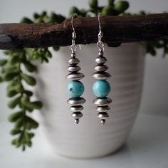 These stunning sterling silver earrings are made by a Navajo silversmith but are not signed. There is a light blue turquoise bead in the center. They are all sterling silver and measure 1 7/8" long from the top of the ear wire and 3/8" wide. Southwestern Sterling Silver Beaded Earrings, Turquoise Sterling Silver Earrings With Silver Beads, Turquoise Earrings Diy, Gemstone Chips Jewelry, Earrings 2024, Pearl Earrings Designs, Silver Bead Earrings, Silver Wire Earrings, Bead Drop Earrings