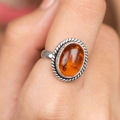 Elevate your style with our exquisite Natural Baltic Cognac Amber Ring, meticulously crafted in 925 Sterling Silver. This timeless piece showcases the warm hues of genuine Baltic Amber, renowned for its rich cognac color and natural beauty. Material: Authentic Baltic Cognac Amber, 925 Sterling Silver Design: Handcrafted for uniqueness and elegance Versatile: Perfect for everyday wear or special occasions Gift Ready: Comes in a stylish box, ideal for gifting Why Choose Our Amber Ring: Indulge in Amber Rings, Soft Board, Amber Gemstone, Zierlicher Ring, Amber Ring, Ring Ideas, Natural Amber, Ring Antique, Amber Stone