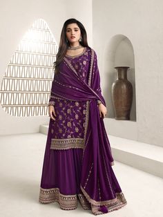 Jacquard chinon sharara suit in Purple colour 66214 Jacquard Chinon Fabric with Jaal Work & Embroidered Scalloped Border Work in Daman and Sleeves on Kurta. Paired with Chinon Fabric Heavy Embroidered Scalloped Border Work in Sharara and Chinon Fabric Buttis Work on Dupatta with Four Sided Scalloped Border. Unstitched suit material till size 42 inches.Desc:  Style : Pakistani Sharara suit Color : Purple Fabric : Jacquard chinon silk Dupatta :Bemberg chiffon Work : Buttis Wash Care : Dry clean Sleeve Style : Full Sleeve Long Sleeves : Done only in Custom Stitch Sleeves Lining : Done only in Custom Stitch Bust Size : 32 to 42 Inches Occasion : Temple Wear   Social Gathering   Pongal   Gudi Padwa   Onam   Ugadi Navaratri Durga pooja Diwali. With Express Free Shipping and Custom Stitching, Plazzo Suits, Indian Salwar Kameez, Palazzo Suit, Sharara Suit, Salwar Kamiz, Designer Anarkali, Anarkali Gown, Party Kleidung, Shalwar Kameez