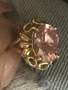 GORGEOUS VINTAGE 14K YELLOW GOLD LARGE PINK STONE RING Very pretty ring crafted of solid 14K Yellow Gold! Band a little bent but does not affect wear. Large pink stone solitaire, 13mm x 11mm Weighs 5.4 grams total. Size 6.25 Shipped with insurance. Formal Pink Gold Ring With Center Stone, Pink Gold Rings For Formal Occasions, Formal Pink Gold Round Rings, Oval Gold Topaz Ring With Diamond Cut, 14k Yellow Gold Topaz Ring With Vs Clarity, Pink Gold Jewelry With Center Stone For Formal Occasions, Formal Pink Gold Jewelry With Center Stone, Antique Pink Rings With Center Stone, Antique Gold Jewelry With Center Stone