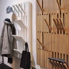 the coat rack is made out of wooden slats