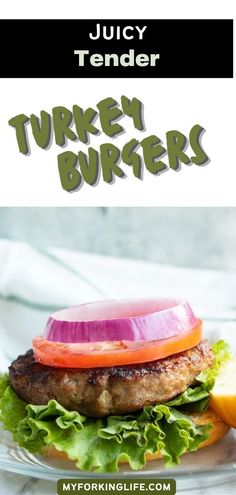 a burger with lettuce, tomato and onion on it sitting on a plate