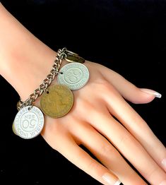 1960's International Coins Charm Bracelet, 11 Coins Total, See "Item Details", Heavy Silver Tone Chain, Secure Fold Over Clasp. Excellent VTG Condition, Genuine Drilled Coins: 2 from India '61 and '64, 2 from Mexico '69 and '69, Canada '67 and '58, Spain '59 and '59, Indonesia '61 and '61, New Zealand '61. Adjustable Vintage Jubilee Charm Bracelet, Vintage Coin Shaped Metal Jewelry, Vintage Round Chain Bracelet, Vintage Adjustable Charm Bracelet Collectible, Vintage Metal Charm Bracelet, Collectible Vintage Bracelets, Vintage Collectible Bracelets, Vintage Nickel-free Bracelets For Anniversary, Vintage Bracelets For Anniversary