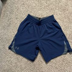 Never Worn Under Armour Summer Shorts With Pockets, Under Armour Blue Shorts For Summer, Blue Under Armour Summer Shorts, Under Armour Blue Bottoms For Summer, Under Armour Summer Blue Bottoms, Blue Under Armour Bottoms With Built-in Shorts, Under Armour Short Bottoms With Pockets, Under Armour Shorts With Pockets, Sporty Blue Under Armour Bottoms