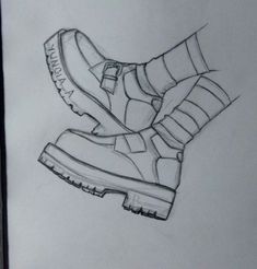 a drawing of a pair of shoes sitting on top of a piece of white paper