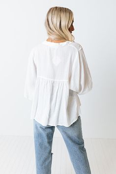 You are sure to receive endless compliments when you complete your look with our cute white 'Ready To Scroll' top featuring lightweight material, a button up front with a collared v-cut neckline, oversized half sleeves, and a relaxed babydoll silhouette that falls into a straight hemline! Measurements S : Bust 46", Hip 56", Length 24", Sleeve Length 12.5", Waist 50". M : Bust 48", Hip 58", Length 24.5", Sleeve Length 13", Waist 52". L : Bust 50", Hip 60", Length 25", Sleeve Length 13", Waist 54" Casual White Split Neck Top, White Henley Neckline Top For Spring, White Henley Neckline Top With Button Closure, White 3/4 Sleeve Blouse For Vacation, White Henley Top With Button Closure, Effortless White Button-up Blouse, Casual White Blouse With 3/4 Sleeves, Casual White Blouse With Split Neck, White Casual Blouse With 3/4 Sleeves