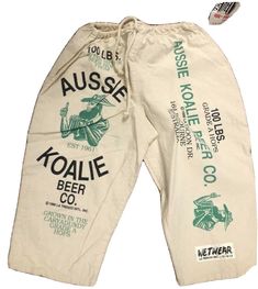 Deadstock Vintage Aussie Koalie Beer Co. Graohic Shorts. adjustable draw string waist Up to a size 34 2 pockets Shipped with USPS Vintage Graphic Design Tee, Vintage Streetwear Bottoms For Spring, Graphic Print Bottoms For Leisure In Spring, Spring Graphic Print Bottoms For Leisure, Spring Leisure Bottoms With Graphic Print, Spring Graphic Print Leisure Bottoms, Beach Graphic Print Cotton Bottoms, Beach Cotton Bottoms With Graphic Print, Retro Graphic Print Bottoms For Spring