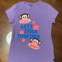 Never Worn Paul Frank Purple T Shirt Happy Bunny Shirt, Fun Purple T-shirt With Funny Print, Casual Purple T-shirt With Cartoon Print, Playful Purple Summer T-shirt, Playful Relaxed Fit T-shirt With Screen Print, Playful Pre-shrunk Crew Neck T-shirt, Playful Relaxed Fit Crew Neck T-shirt, Purple Cartoon Print Fun T-shirt, Cute Purple Tops With Relaxed Fit