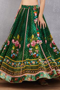 Emerald green lehenga with multi-color floral motif print, striped pattern and kamar tassel detail. Comes with plunging neck blouse and fringe border dupatta.
Component: 3
Printed
Neckline: Sweetheart
Sleeve Length: Cap
Fabric: Blouse and Lehenga: Velvet, Cotton Silk; Lehenga: Dupion; Dupatta: Net and Cotton Silk
Color: Green
Kamar latkans
Tie-up back
Fringe dupatta - Aza Fashions Bohemian Green Choli With Cutdana, Green Bohemian Choli With Cutdana, Green Silk Floor-length Lehenga, Green Bohemian Gown For Festive Occasions, Green Bohemian Choli With Pallu, Semi-stitched Green Bohemian Lehenga, Green Bohemian Choli For Reception, Bohemian Green Choli For Reception, Bohemian Green Sharara For Reception