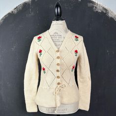 This is a nice vintage hand knitted cardigan, made of pure wool! The cardigan will definitely be warm. It has nice wooden buttons, a drawstring and hand embroidered red flowers. An amazing gift and treat for yourself or someone you love! MAKE: Most likely made in Austria or Germany, no labels. CONDITION: Very good. MATERIAL: 100% pure wool, no labels. MEASUREMENTS NOTE: Please refer to the exact measurements and sizing table I used, as this one does not have size labels! Bust: 90cm/35.5" Waist: Cardigan Vintage, Winter Boho, German Christmas, Wooden Buttons, Knitted Cardigan, Red Flowers, Cardigans For Women, Knit Cardigan, Hand Embroidered