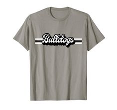 PRICES MAY VARY. Support your sports team with this vintage-inspired bulldogs mascot t-shirt. Great shirt for all sports teams, Football, Baseball, Soccer, Basketball, Track, Softball, Swim Team, Cheerleader, Marching Band. High School mascot, college, school spirit. Great gift for birthdays or Christmas for a Bulldog sports fan in Georgia, high school, elementary school or college! Retro Shirt Design, Graphic Tee, Black and White Stripe, Mens, Womens, Kids, Youth, Mom, Dad, Brother, Little Sist School Spirit Wear Designs, Band High School, Football Spirit Shirts, School Tshirt Designs, Spirit Wear Designs, School Spirit Shirts Designs, Team Shirt Designs, Team Spirit Shirts, Retro Shirt Design