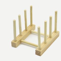 a wooden stand with four poles and measurements for each piece in the same size as shown