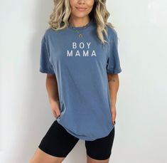 The Boy Mama Simplistic Neutral Tee offers a timeless, relaxed fit with a soft, lived-in feel that makes it perfect for everyday wear. Featuring a classic crew neckline and a clean, minimalist design, this tee is screen-printed with environmentally safe inks for durability. Its neutral color palette ensures easy styling, whether you’re pairing it with jeans, leggings, or shorts. For long-lasting quality, wash the tee inside out on a gentle cycle with cold or lukewarm water, and tumble dry low or line dry. Colors may vary slightly based on your device’s display settings. Mama Shirts Vinyl, Stylish Boy, Boy Mama, Newborn Gown, Pajama Romper, Mama Tee, Moms Club, Saved By Grace, Mama Shirts