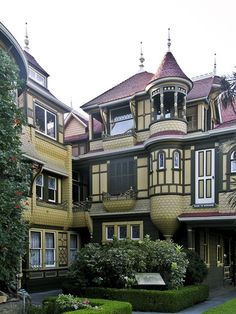 an old victorian style house with lots of windows and balconies on the second floor