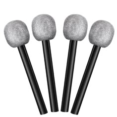 four black and white brushes with glitter on them