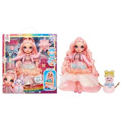 the doll is next to its box and it looks like she's wearing a pink dress