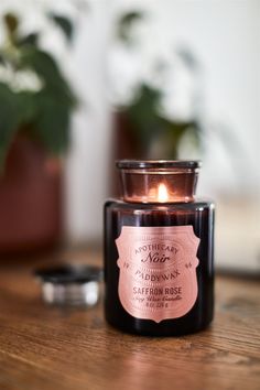 a candle sitting on top of a wooden table