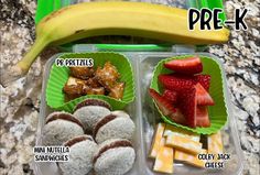 a plastic container filled with different types of food next to a banana and other foods