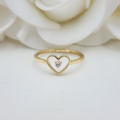 Our Adorable solid Gold Heart Solitaire CZ ring is crafted in Solid 14k Gold which makes it perfect to wear everyday and in every occasion.this ring is simple yet perfect. Unique, elegant and everlasting. 14k Gold will not tarnish or rust. Materials: 14k Gold, CZ Diamonds Stone size: 2mm Heart size: 8x7mm Band width: 1.5mm Weight: 1.3 grams 14k stamped  Brand new Follow us in our social media for more solid 14k Gold Jewelry. Please. Do not hesitate to contact me i will be happy to answer all you Valentine's Day Heart Ring With Single Diamond, Heart-shaped Single Diamond Jewelry For Promise, Heart-shaped Single Diamond Promise Ring, Everyday Open Heart Rings With Heart Charm, Everyday 14k Gold Heart Ring, Fine Jewelry Style, Delicate Gold Heart Ring For Everyday, Birthstone Open Heart Promise Ring, Gold Heart Ring For Everyday Fine Jewelry, Minimalist Rings For Everyday And Valentine's Day