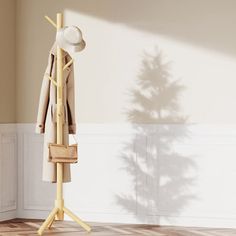 a hat and coat rack in an empty room