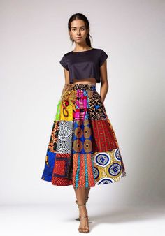 this ankara midi skirt in patchwork african print is a vibrant and stylish choice. the combination of ankara fabric and a midi length offers a unique and culturally rich look. the patchwork design adds an element of creativity and individuality to the skirt. this type of skirt can be a versatile addition to your wardrobe, suitable for both casual outings and more formal occasions. Patchwork Skirt Outfit, Ankara Midi Skirt, African Outfits For Women, Ankara Skirt Styles, African Clothing Stores, Ankara Skirts, Skirt Patchwork, Fancy Skirts, Patchwork Clothes