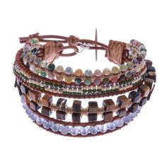 This eye-catching wristband bracelet from Siriporn in Thailand features 4 brown leather strands each knotted with different beads. One strand features a double row of agate beads in a rainbow of colors; the next is strung with tiny glass beads in green cream and copper. The third strand is studded with cubes of tawny tiger's eye while the fourth strand is populated with gray quartz beads. The bracelet can be fastened at one of two lengths with a 950 silver toggle. Adjustable Hand Wrapped Leather Bracelet With Round Beads, Adjustable Hand-wrapped Beaded Leather Bracelet, Bohemian Adjustable Hand Wrapped Leather Bracelet, Adjustable Hand-strung Leather Bracelet, Adjustable Natural Stones Wrap Bracelet, Adjustable Hand Wrapped Spiritual Leather Bracelet, Earthy Adjustable Hand Wrapped Bracelet, Adjustable Earthy Hand Wrapped Bracelet, Adjustable Brown Bracelets As Fashion Accessory