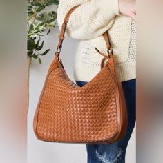 This Handbag Exudes Elegance And Durability. The Intricate Weaving Detail Showcases Fine Craftsmanship While Adding A Touch Of Texture And Uniqueness To Your Ensemble. With Its Versatile Size And Functional Crossbody Strap, This Handbag Effortlessly Combines Style And Practicality, Making It A Versatile Accessory For Everyday Use Or Special Occasions. Material: Vegan Leather Features: Advanced Vegan Leather, 100% Handmade Woven Pattern With Stitching Detail, And Long Adjustable And Detachable St Strap Bag, Woven Pattern, Bag Straps, Leather Handbag, Crossbody Strap, Vegan Leather, Special Occasion, Stitching, Weaving