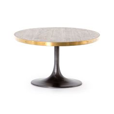 a round dining table with gold trim on the top and an iron base, against a white background