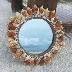 there is a mirror with shells on it