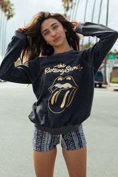 FREE SHIPPING ON ORDERS OVER $60 Don't miss out on this exclusive Rolling Stones Sticky Fingers Sweatshirt! Show off your rock 'n' roll spirit in style with this eye-catching graphic sweatshirt featuring a cool gold foil print. The relaxed fit and super soft organic cotton make it cozy and easy to wear, so you can rock out in comfort! Color: Black Fabric: 100% Organic Cotton Model wears a small Made in Los Angeles Rolling Stones Sticky Fingers, Sticky Fingers, Raglan Sweatshirt, Gold Foil Print, Comfort Color, Cardigan Top, Foil Print, Dress With Cardigan, Clothing Co