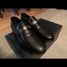 Made Of Iconic Saffiano Leather, These Loafers Are Characterized By The Logo On The Front Metal Tag. Upper: Saffiano Leather Logo Applied On The Enameled Metal Tag Upper With Apron Toe Rubber Sole Mens Prada 6. Made In Italy, Slip On, Smooth Calf Leather With The Bar On Top With Embedded Logo. This Is Unworn, New In The Box Luxury Business Loafers With Round Toe, Luxury Round Toe Business Loafers, Luxury Round Toe Loafers For Business, Luxury Round Toe Loafers For Semi-formal Occasions, Luxury Monk Strap Shoes With Removable Insole For Office, Luxury Monk Strap Shoes For Office With Removable Insole, Luxury Semi-formal Loafers With Rubber Sole, Luxury Semi-formal Loafers With Round Toe, Designer Semi-formal Slip-on Monk Strap Shoes