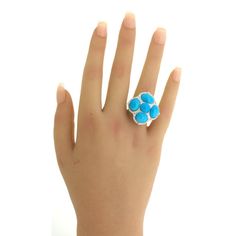 A lovely cocktail ring featuring 5 pieces of fine and matching turquoise. The turquoise have a rich even sky blue color most likely originating from the famous turquoise mines in Iran. They are complemented by 0.68 carats of round brilliant-cut diamonds set around them adding brilliance and sparkle to the piece. Made in 18k white gold and ready to be worn and loved!    Ring Size 7    Weight: 17.4 grams  Dimensions for this item are unknown. Please reach out with any questions on measurements. Luxury Blue Multi-stone Turquoise Ring, Fine Jewelry Blue Turquoise Cabochon Ring, Sky Blue Color, Gold Cocktail Ring, Gold Cocktail, Round Brilliant Cut Diamond, Cocktail Ring, Cocktail Rings, Round Brilliant