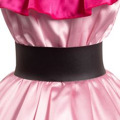 a pink and black dress with ruffles on the top, belted at the waist