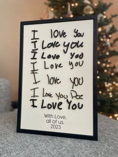 a christmas card with the words i love you written in cursive writing on it