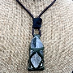 This is a fun, crystal and stone holder necklace; also known as a cage necklace, for crystals that features a leather cord with leather cage to hold a crystal point. This specimen holding necklace is also the perfect size to hold other rock specimens. Measurements of the cage are: 1.5 inches by 0.50 inches. This necklace is adjustable from choker length to 24 inches. Available colors: black, red, blue and brown cage. *Please note: Crystal not included Cleaning Instructions: You can use a soft mi Adjustable Crystal Necklace With Large Stone In Spiritual Style, Adjustable Spiritual Crystal Necklace With Large Stone, Holding Necklace, Stone Holder Necklace, Crystal Holder Necklace, Cage Necklace, Caged Necklace, Crystal Holder, Crystals Stones