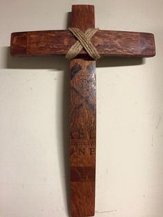 a wooden cross hanging on the wall