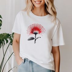 Unisex "Ohia Lehua" T-Shirt - Embrace Hawaiian Beauty Make a statement with our "Ohia Lehua" t-shirt, featuring a bold red Hawaiian ohia lehua flower design. This ohia lehua shirt is perfect for nature lovers, botanical enthusiasts, and anyone who appreciates the unique beauty of Hawaii. Why You'll Love It: Premium Quality: Made from ultra-soft, high-quality cotton for maximum comfort and durability. Unique Design: The striking graphic showcases the vibrant red ohia lehua flower, a symbol of Hawaiian natural beauty and resilience. Versatile Wear: Ideal for casual outings, nature walks, or as a conversation starter at gatherings. Thoughtful Gift: Perfect for plant lovers, botanists, and anyone who cherishes Hawaiian culture. Features: Available in various sizes (S-5XL) to fit all nature ent Spring Casual Yoga T-shirt, Graphic Print Short Sleeve Tops For Yoga, Summer Yoga Cotton T-shirt, Cotton Yoga T-shirt For Summer, Cotton T-shirt For Yoga In Summer, Red T-shirt For Summer Gift, Cotton Relaxed Fit Top For Meditation, Casual Crew Neck T-shirt For Yoga, Cotton Short Sleeve Yoga T-shirt