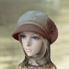 This felt wool  women's cap with visor is a very stylish. It has a small visor and decorated with 3 flowers which made of the same fabric as the cap.  It is quite soft to the touch. 100% WoolThe cap has elastic behind to insure comfy fit. The cap  fits an average size women's head. Lightweight and warm at the same time suitable for all occasions. This headpiece is a timeless classic and great for all ages. Features a visor is great for a hip, trendy look. It will  keep you warm, yet you will  lo Brown Wool Visor Hat, Wool Visor Hat For Fall, Wool Visor Hat For Winter, Fall Wool Visor Hat, Winter Wool Visor Hat, Fall Wool Hat With Visor, Beige Brimmed Felt Hat For Winter, Beige Wool Felt Hat For Winter, Winter Beige Wool Felt Hat