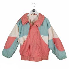 "Pastel pink, blue and white Pit to pit 22\"  Neck to hem 24\"  Pit to cuff 17.5\"" Casual Pink Patchwork Windbreaker, Vintage Pink Outerwear For Streetwear, Pink Retro Windbreaker For Streetwear, Retro Pink Windbreaker For Streetwear, Vintage Pink Outerwear With Pockets, Pink Color Block Winter Outerwear, Retro Pink Windbreaker, Pink Retro Patchwork Outerwear, Retro Pink Patchwork Outerwear