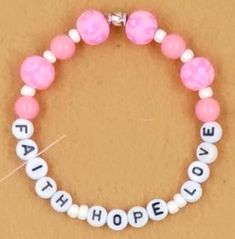 Faith Hope Love Affirmation Bracelet.  The pink ceramic beads are surrounded by Faith Hope Love lettering.   This bracelet will easily stretch. Make your selection using size chart.   Be sure to measure your wrist in inches to determine the size that is comfortable for you, including the ability to slip it over your hand Affirmation Bracelets, Love Affirmation, Harrisburg Pa, Bracelet Friendship, Love Bracelet, Pink Ceramic, Love Affirmations, Faith Hope Love, Hope Love