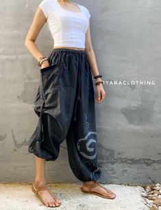 The harem style trousers made from cotton fabric 100%with an elasticated smock waist and ankles they provide a comfortable lightweight fit, perfect for casual wear, festivals, yoga, holidays as well as pairing with a plain top to get that popular look.   Materials: Cotton Sizing: One size fits most. Size : (inches) ✿Waist : 22-42 inch ( 55-106 cm ) ✿ Hip :up to 49 inch ( 124 cm) ✿ Length 39" ( 100 cm ) ✿2 sides pockets S I Z E : US SIZE 4 - 12 , UK SIZE 8 - 16 , EU SIZE 36 - 44 MODEL SIZE : size Casual Spring Harem Parachute Pants, Summer Cotton Harem Pants With Loosely Fitted Hips, Ankle-length Relaxed Fit Harem Pants, Summer Harem Parachute Pants With Elastic Waistband, Baggy Hippie Harem Pants With Elastic Waistband, Baggy Harem Pants With Elastic Waistband In Hippie Style, Hippie Baggy Harem Pants With Elastic Waistband, Casual Cotton Parachute Pants For Festival, Hippie Cotton Parachute Pants For Summer