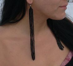 These extra long white earrings are made with black seed beads. Silver plated ear wires. Length approximately (including ear wires) -8.5 inches (21.5 cm) Indigenous Earrings, Extra Long Earrings, Shoulder Duster Earrings, Duster Earrings, Tassel Earring, Black Earrings Dangle, Gothic Earrings, Long Fringe, Long Fringes